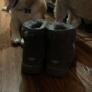 Gray UGG boots with silver glitter trim.